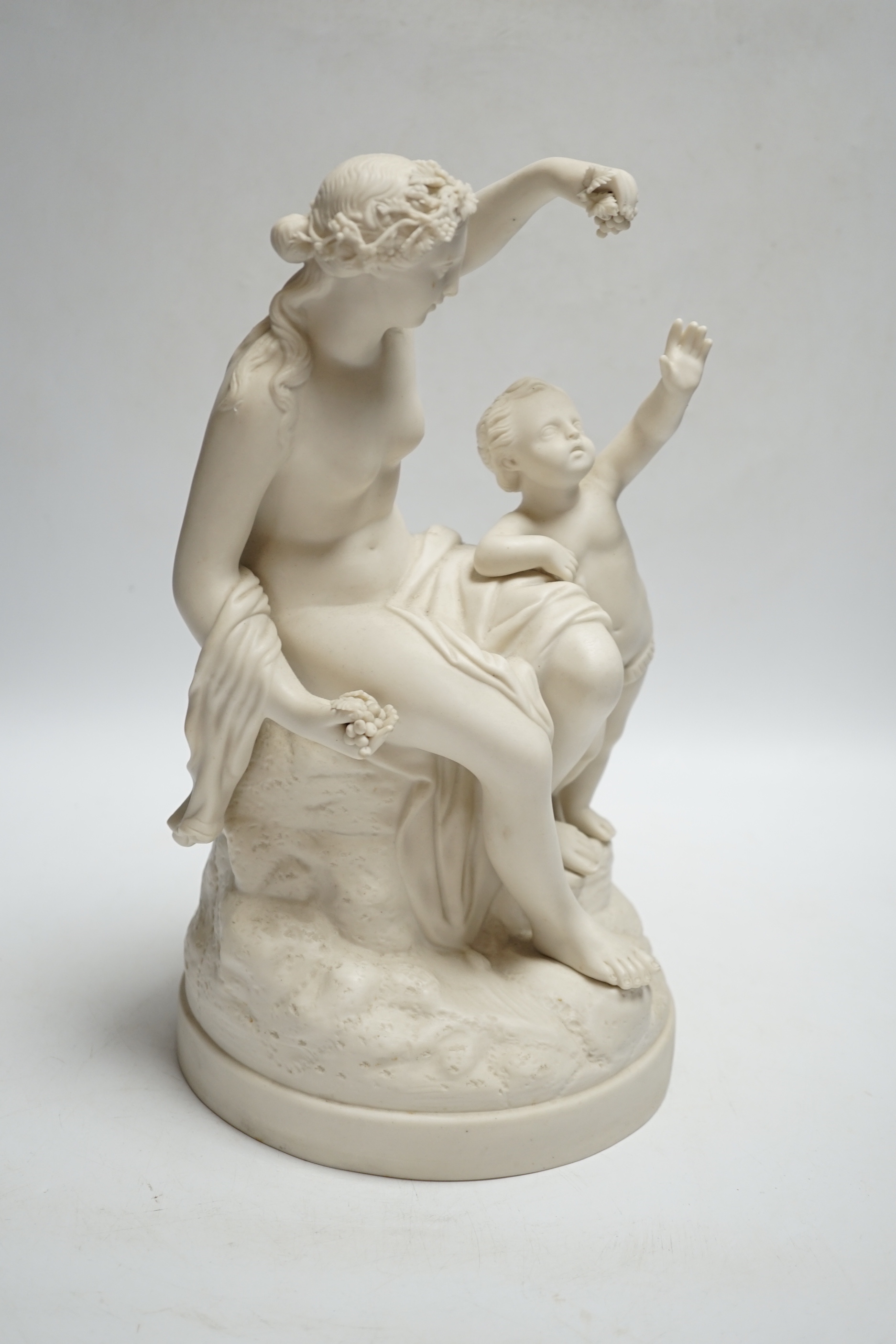 A late 19th century parian group of a goddess and putti, 31cm